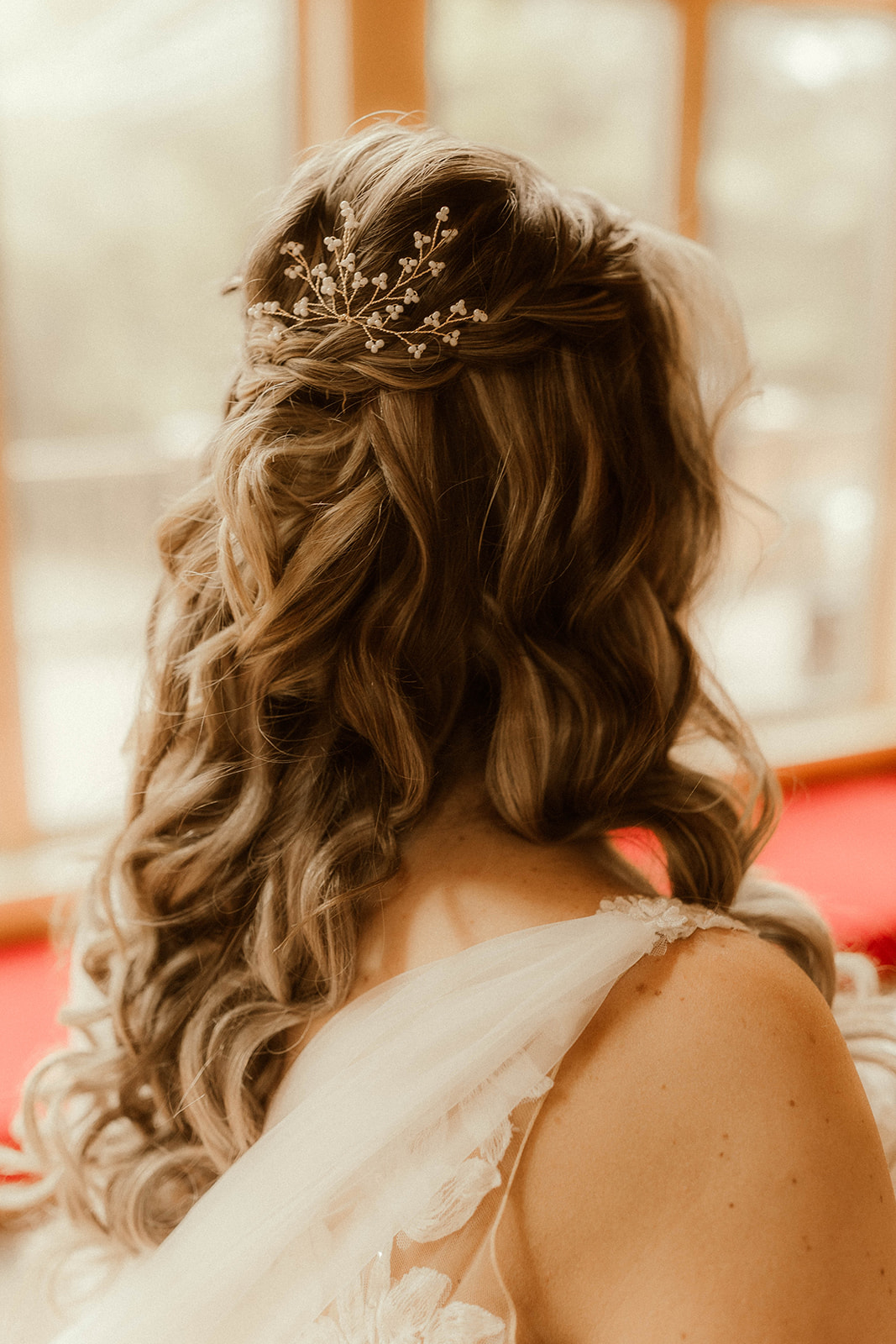 A detail shot of the stunning brides hair for her romantic Adirondack mountain elopement