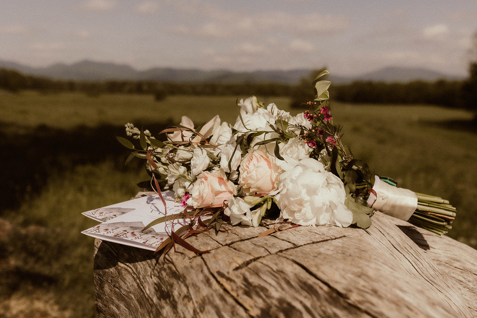 Stunning flat-lay of elopement details laid out in the Adirondack mountains