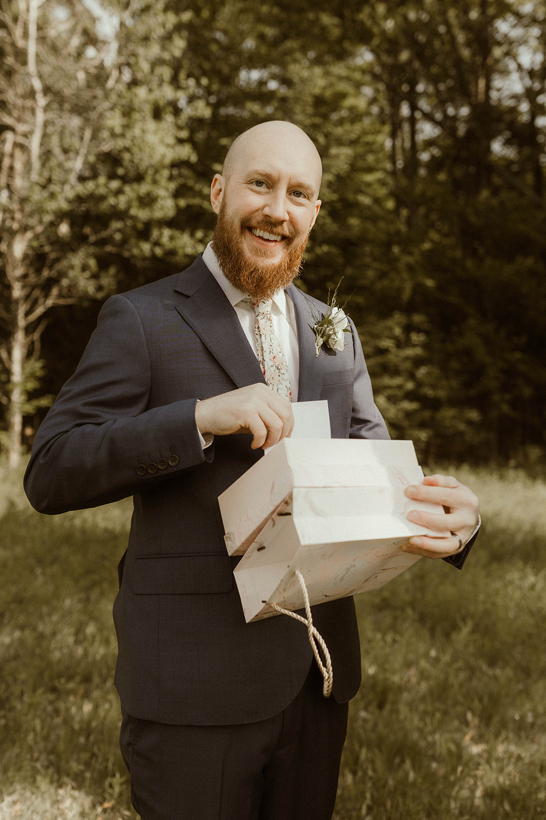 Bride and groom exchange meaningful gifts before their Adirondack mountain elopement