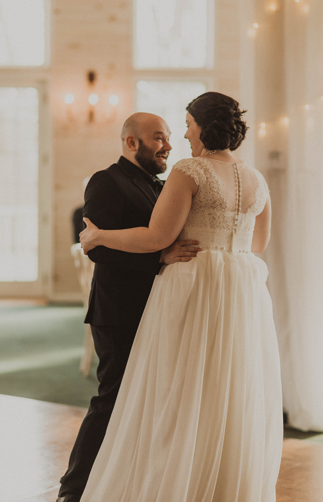 Bride and groom share their first dance together during their dreamy upstate New York wedding