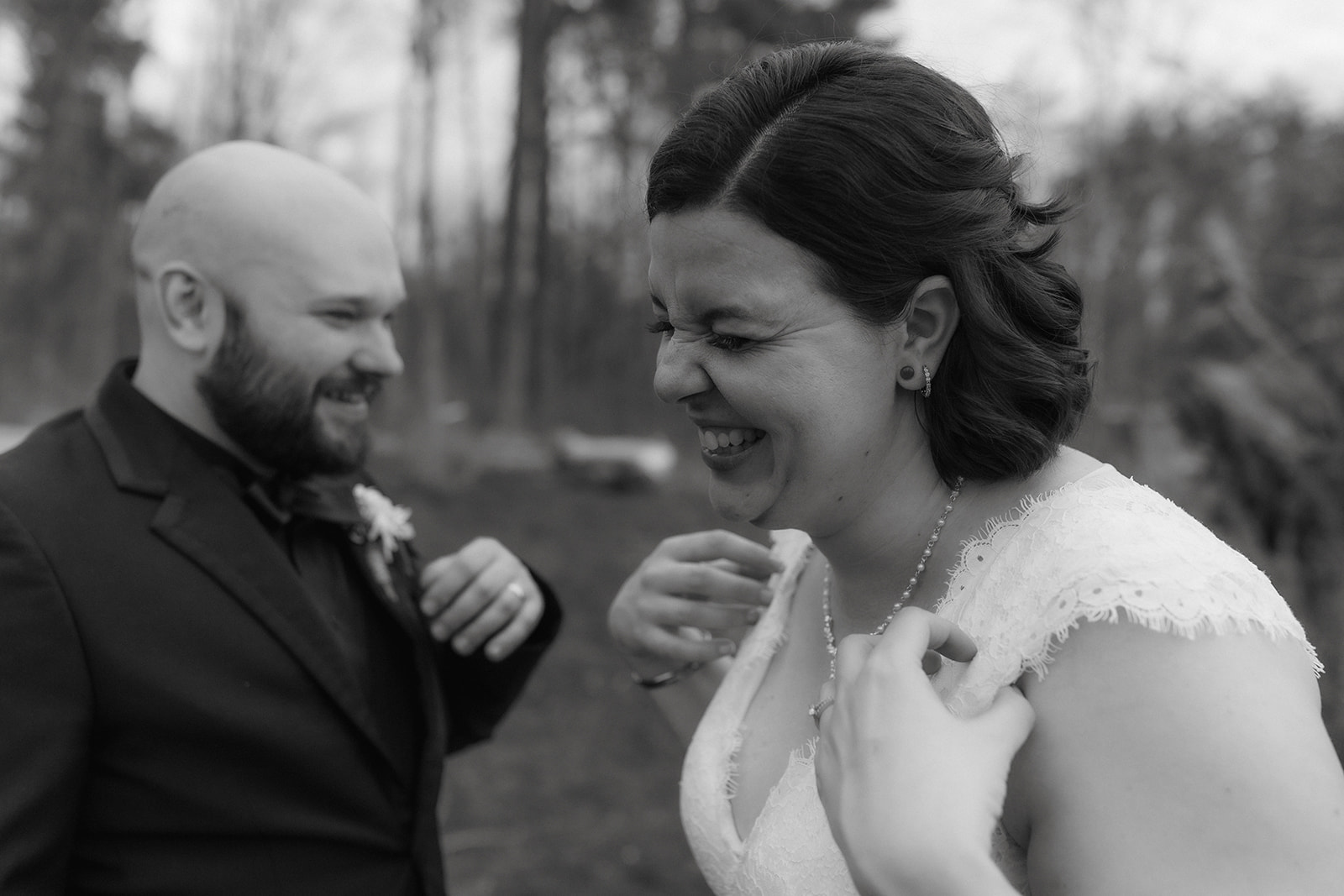 Bride and groom share a laugh on their upstate New York wedding day