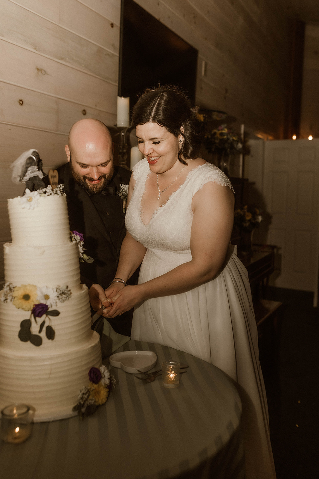 Bride and groom cut their wedding cake on their dreamy upstate New York wedding day