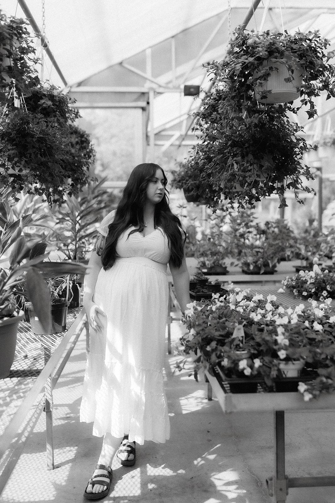 Stunning soon to be mother poses with flowers during her unique maternity shoot