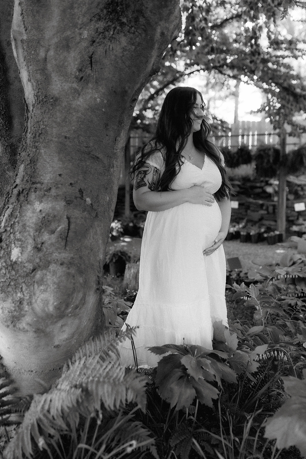 Elegant soon to be mom poses during her nursery maternity photoshoot