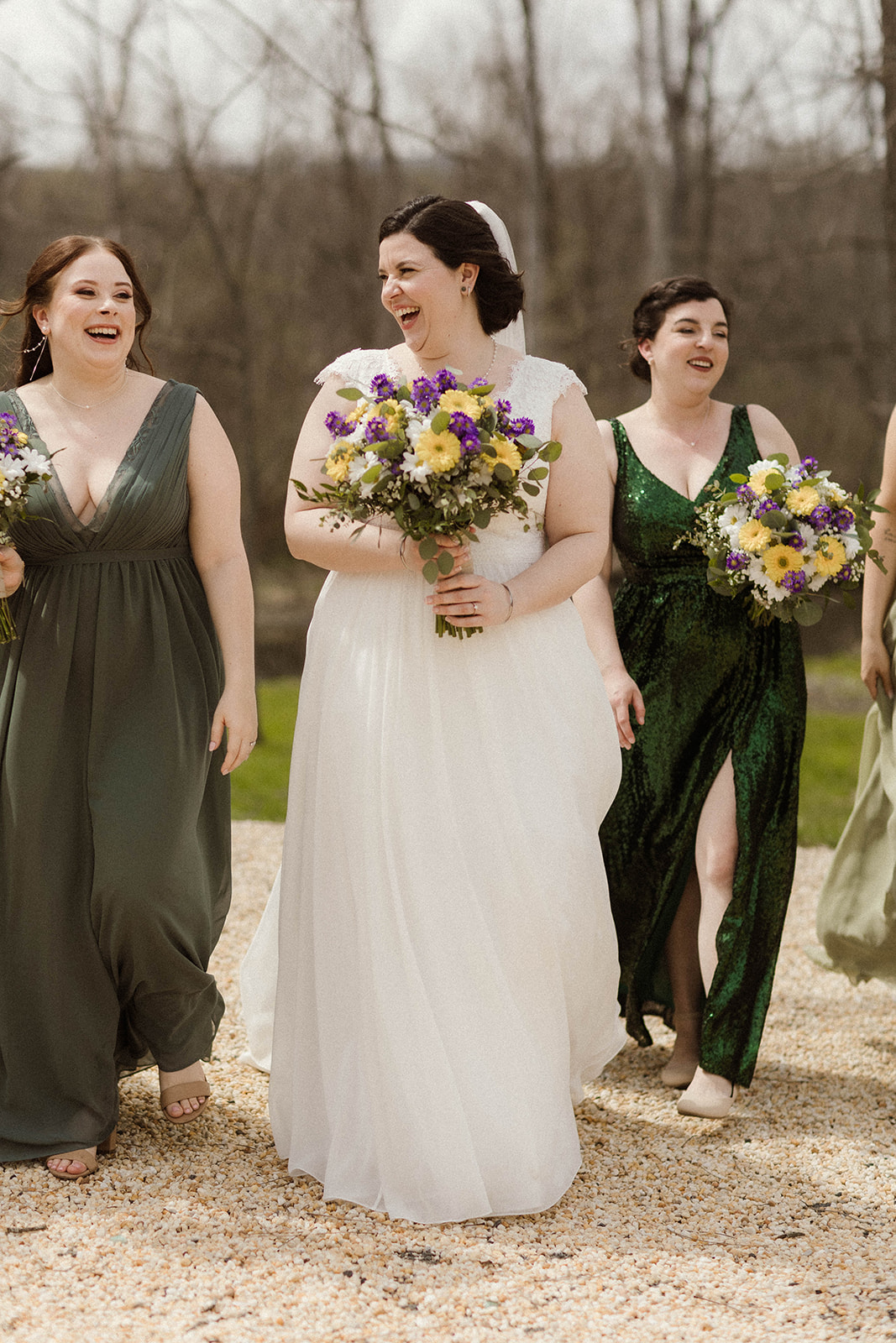Bridesmaids pose with the bride on her upstate New York wedding day