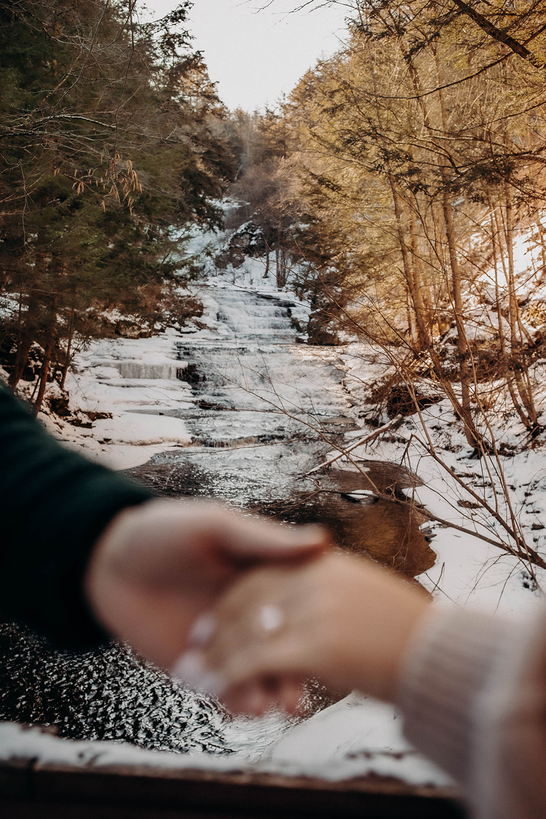 Detail shot of an engagement ring during snowy engagement photoshoot at Huyck preserve!