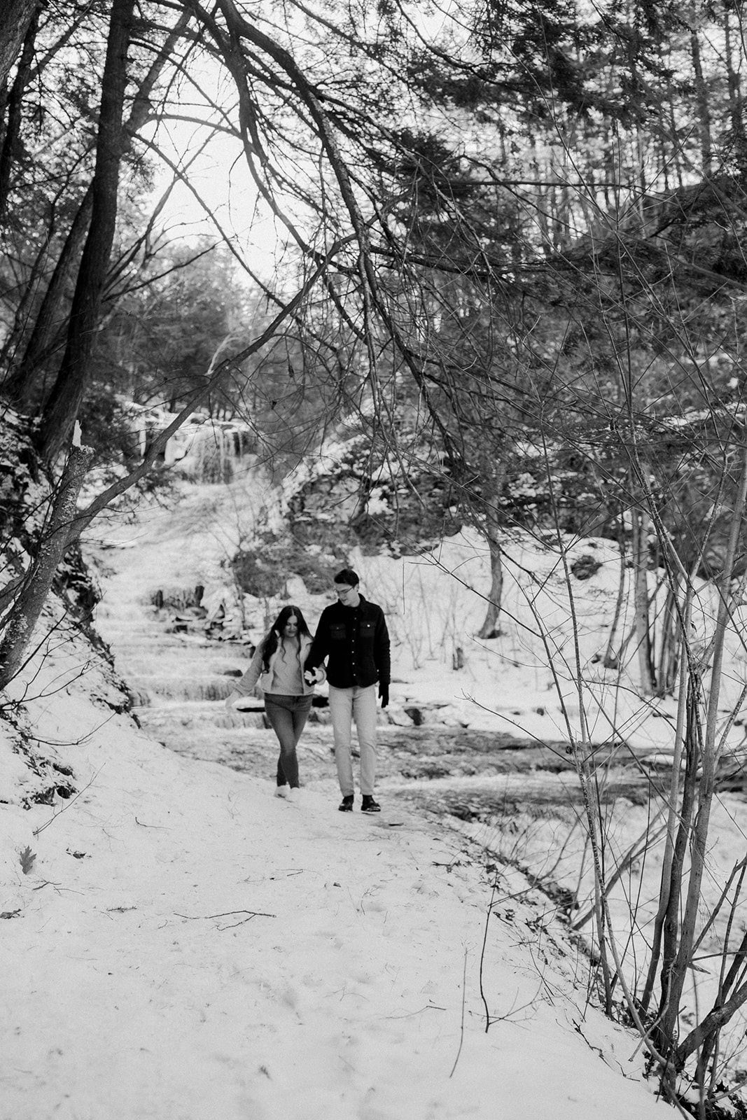Candid walking photo during engagement photoshoot at Huyck preserve!