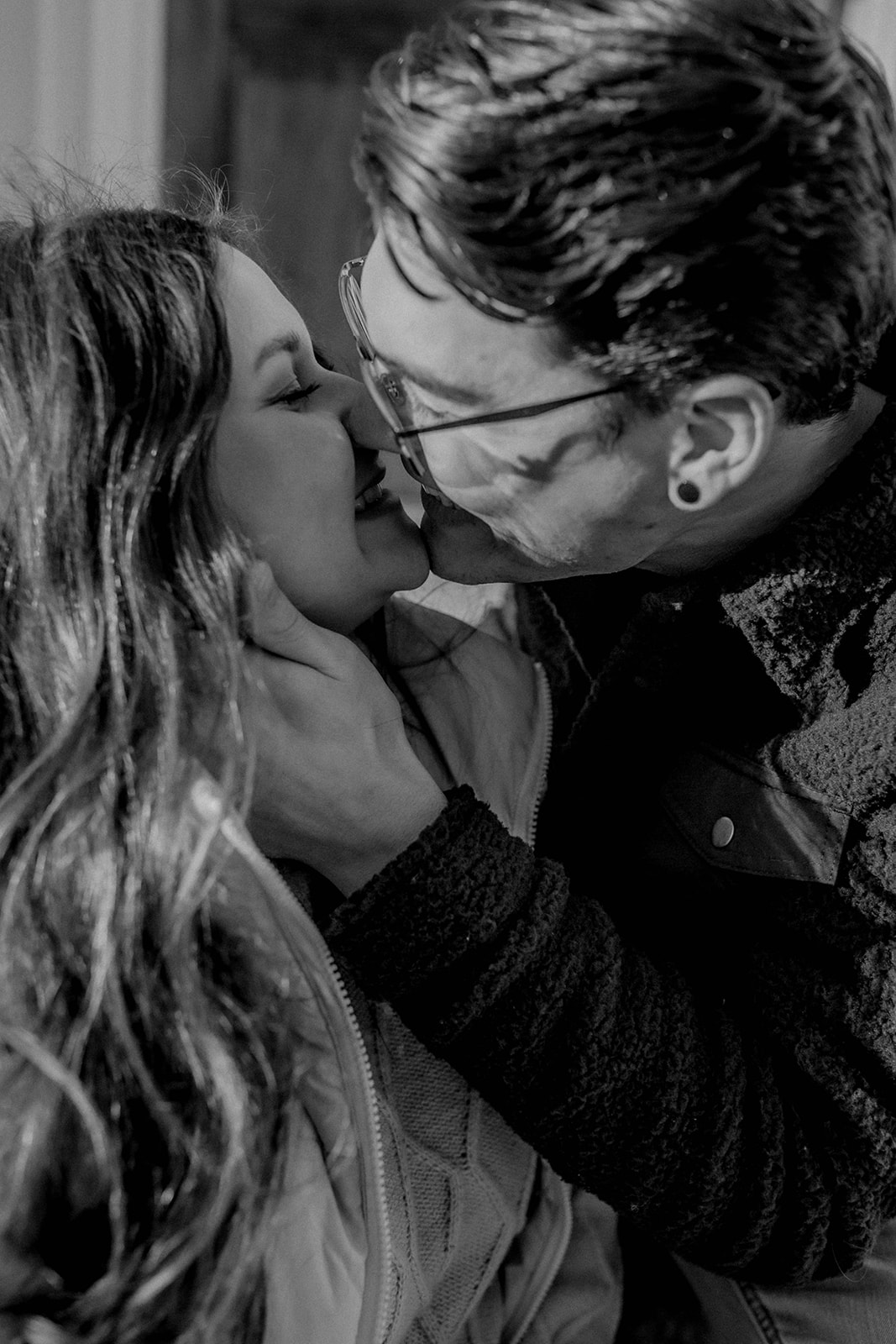 Couple share a romantic kiss during their dreamy engagement photoshoot 