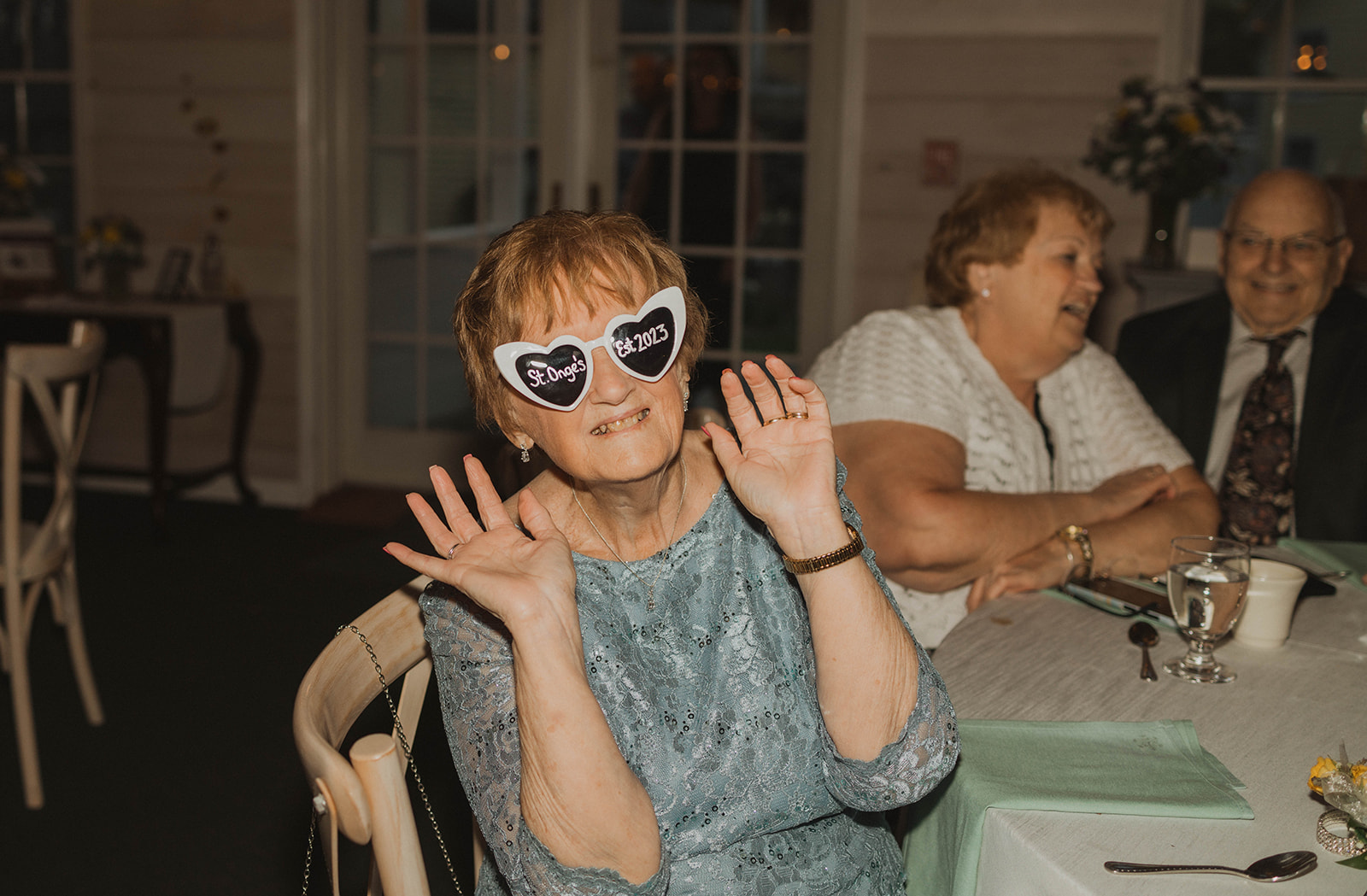 Wedding guests enter the dance floor with new sunglasses