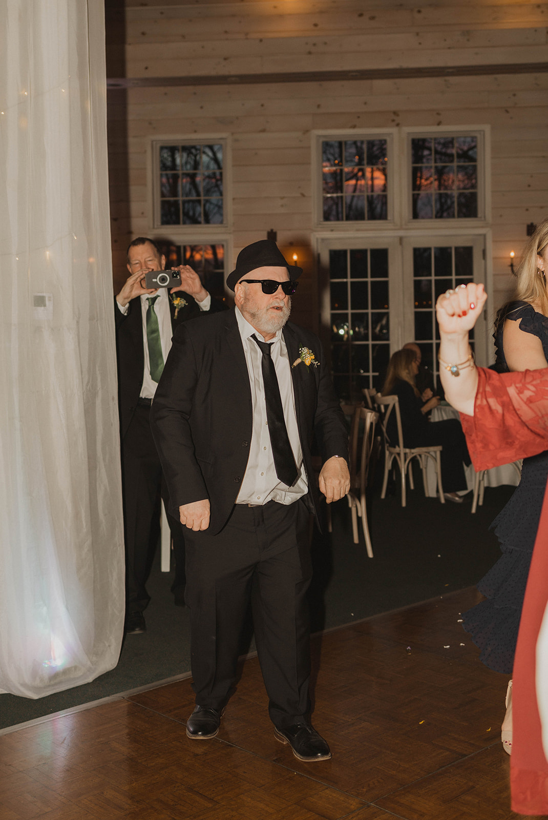 Wedding guests enter the dance floor with new sunglasses