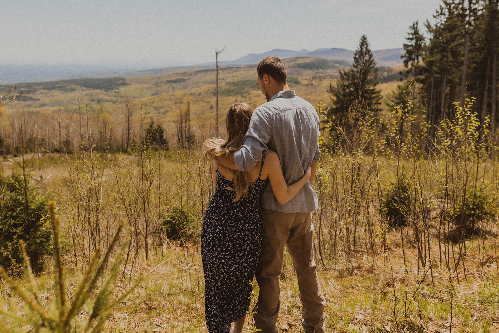 Future parents pose romanticly together during their western maternity photos