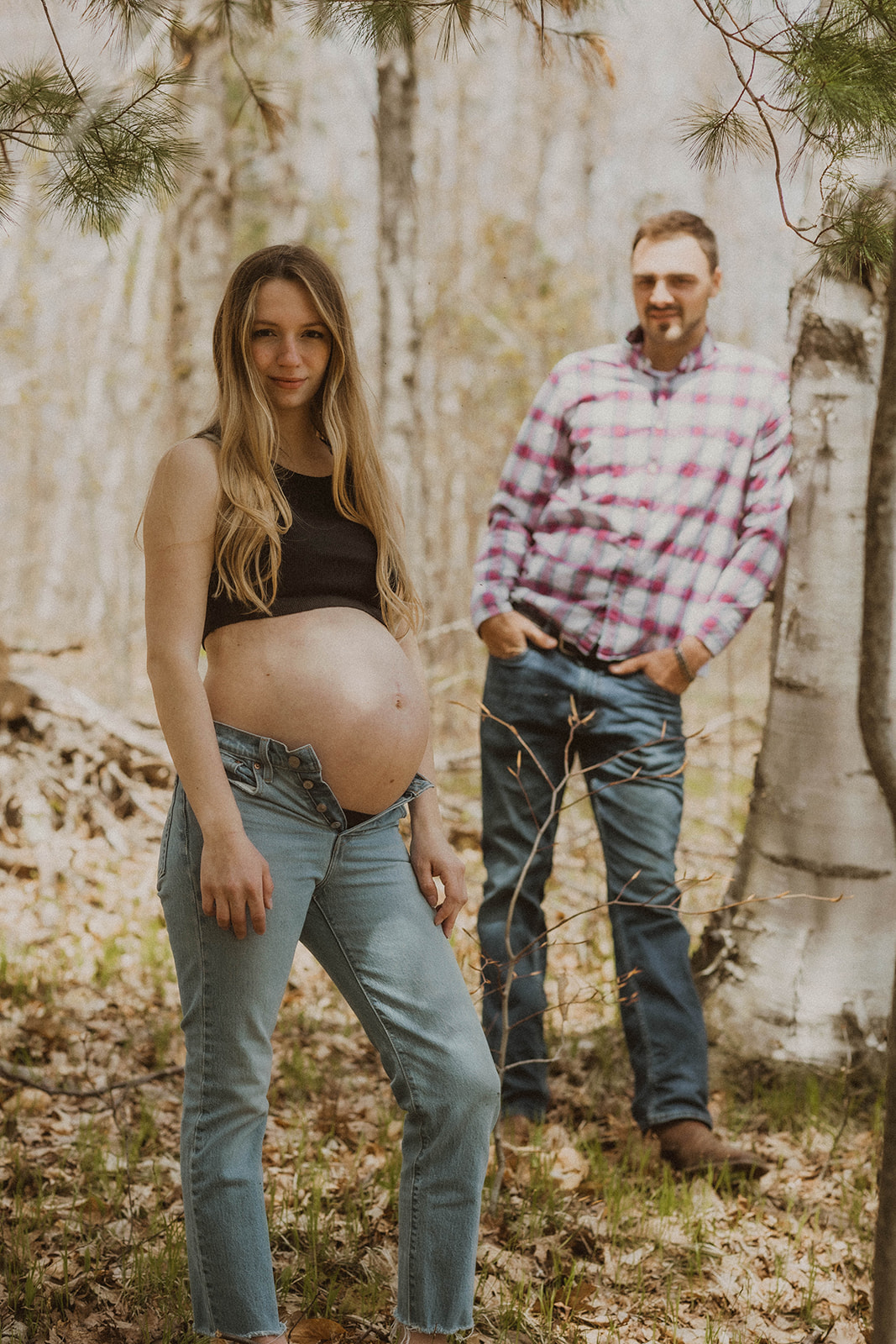 Future mom and dad pose together in the New York wilderness during their Western maternity photos