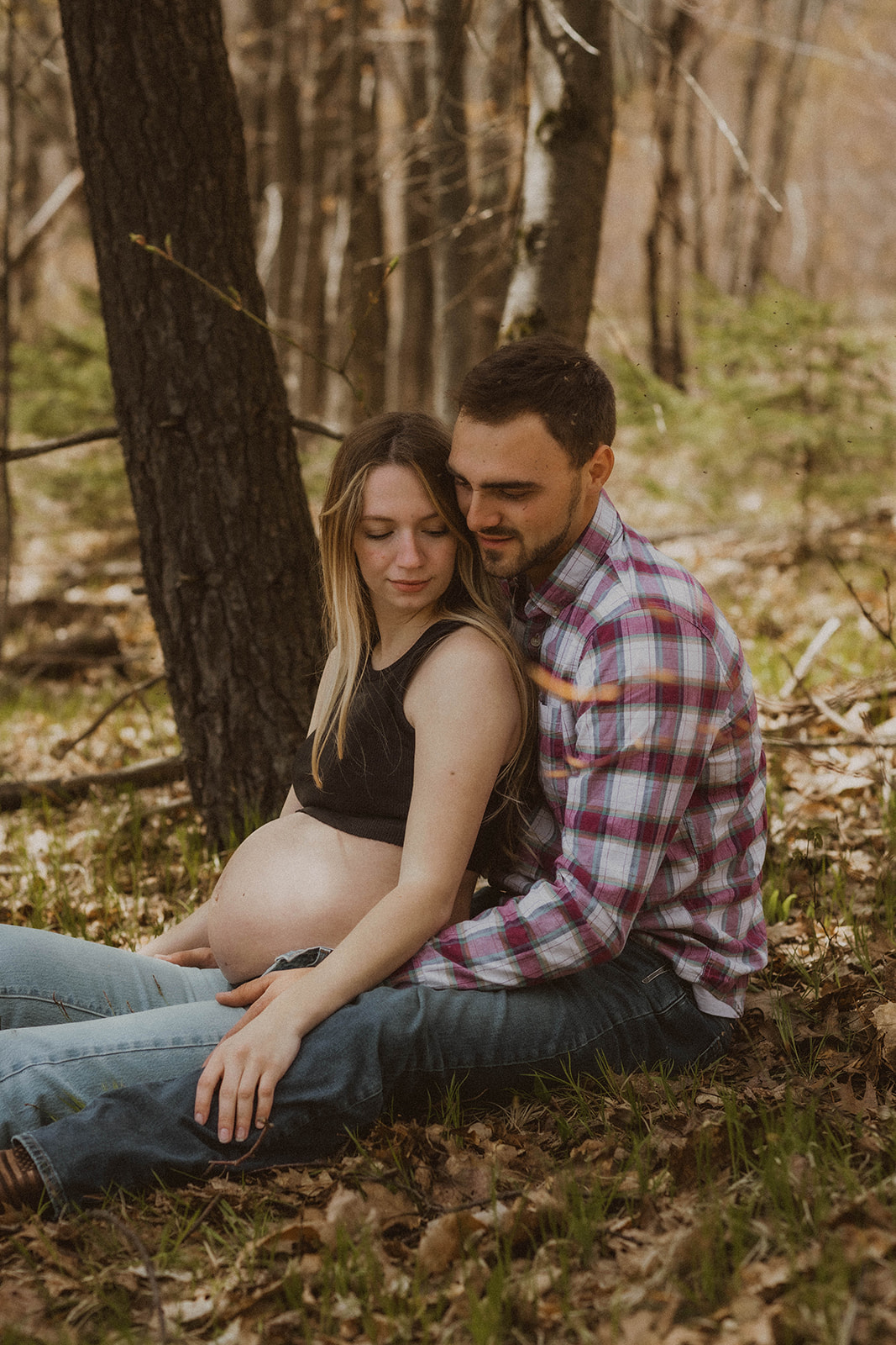 Future parents pose intimately together during their western maternity photos