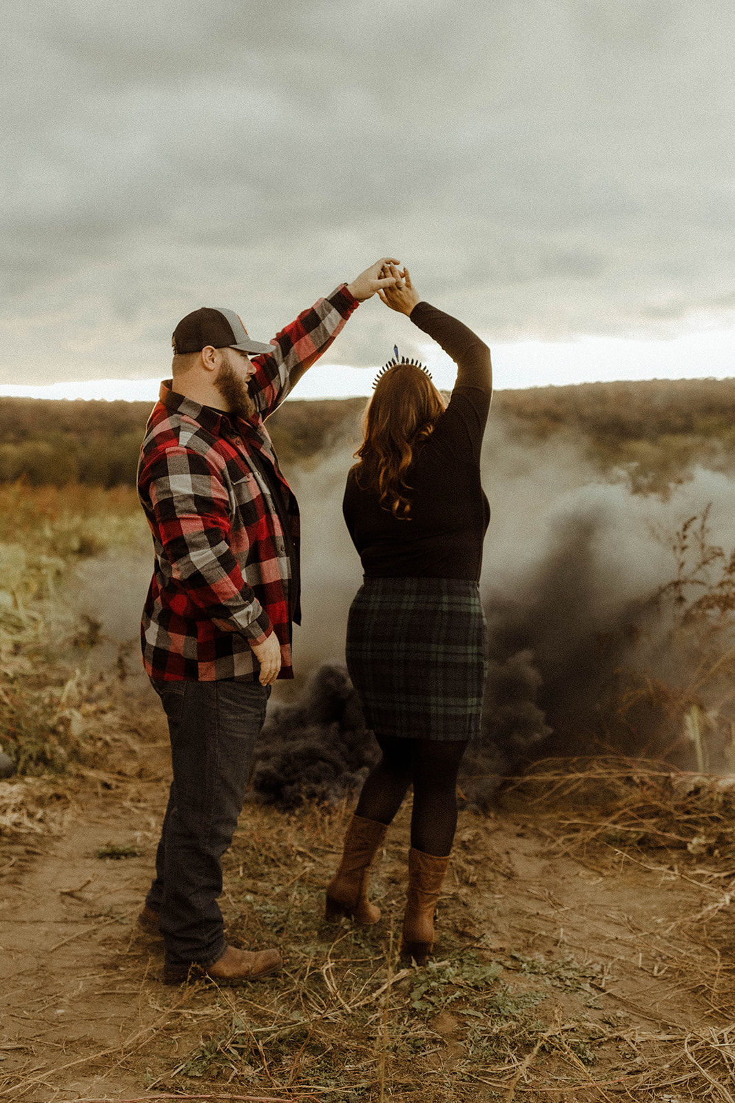 Stunning couple dance together in a pumpkin patch during their Upstate New York farm engagement photos