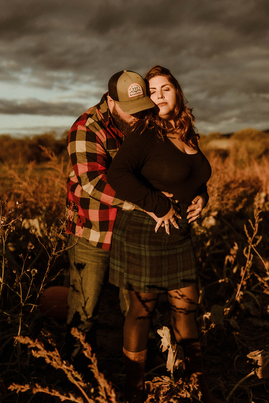 Dreamy couple pose together on their farm during their Upstate New York farm engagement photos