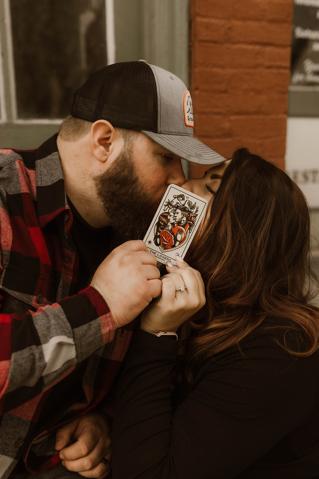 Stunning couple pose together with tarrot cards during their upstate New York engagement photoshoot