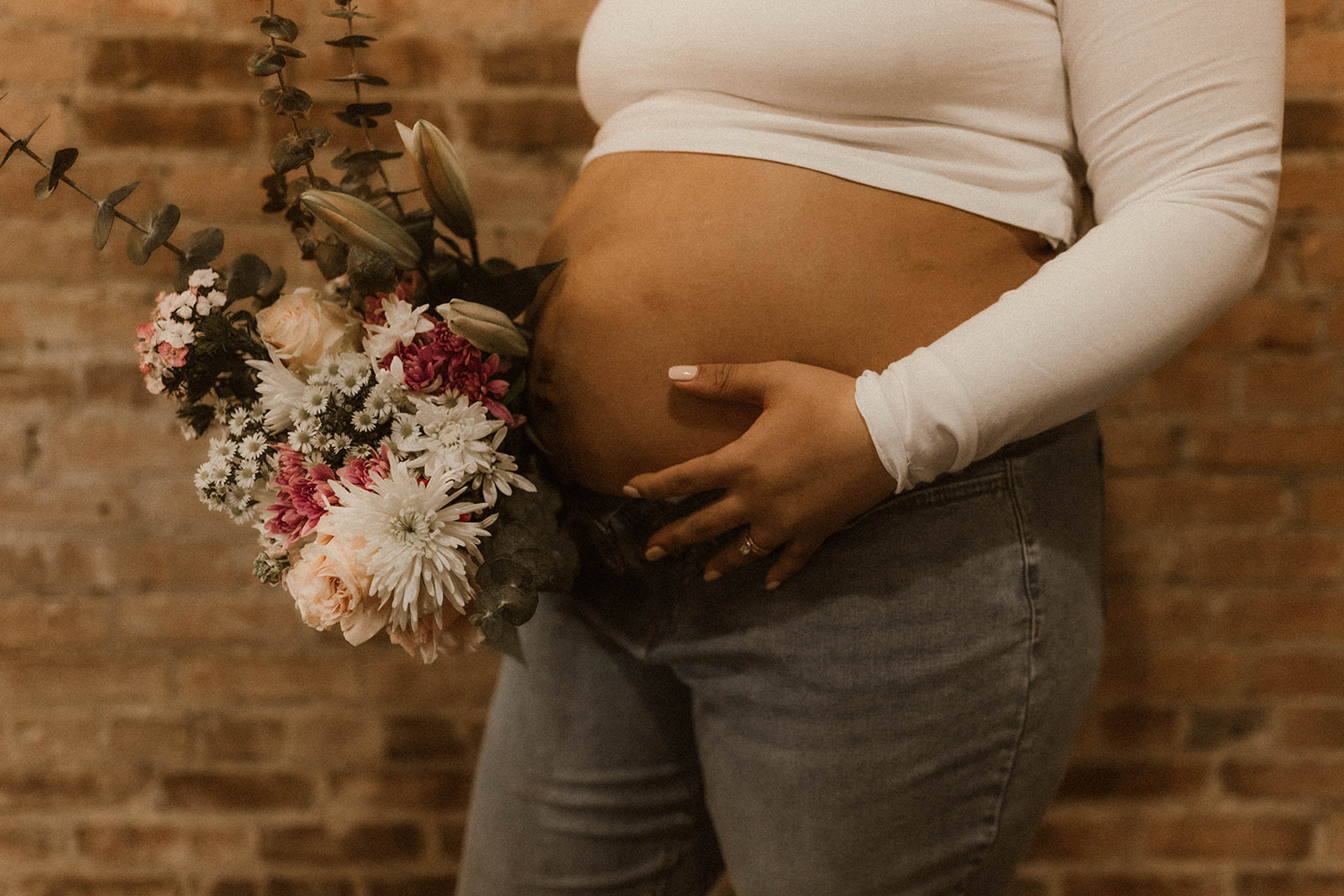 Maternity session with baby bump and flowers