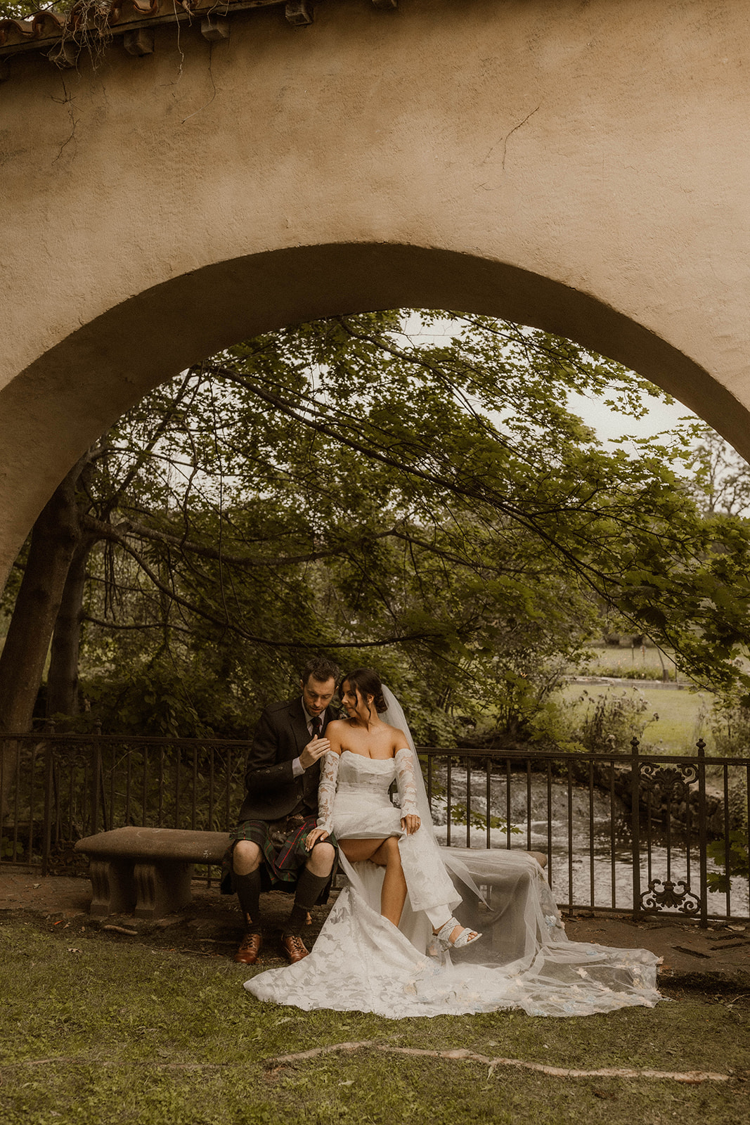 Elena and Ben share a tender moment against the backdrop of Melody Manor Resort's scenic vistas.