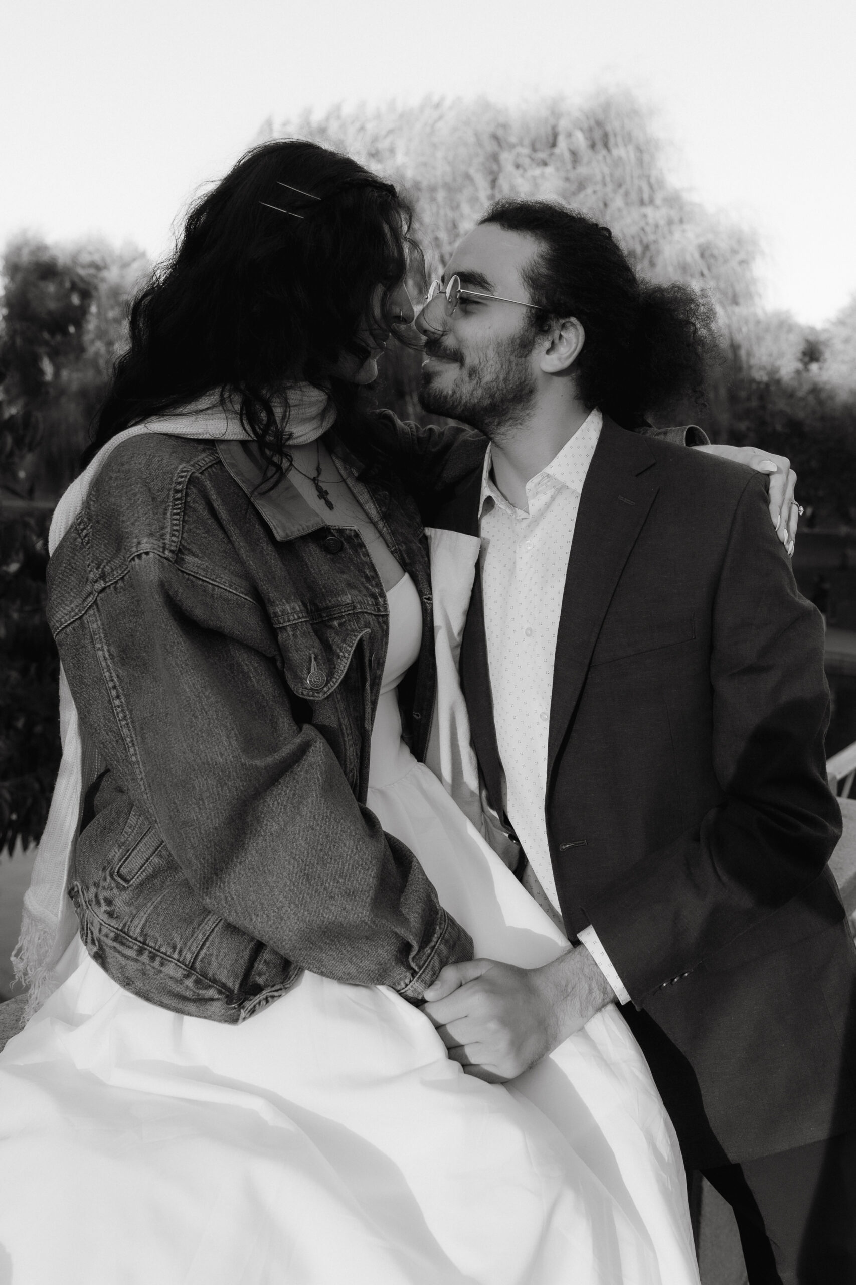 Courtney and George laughing together in Boston Common during their engagement session