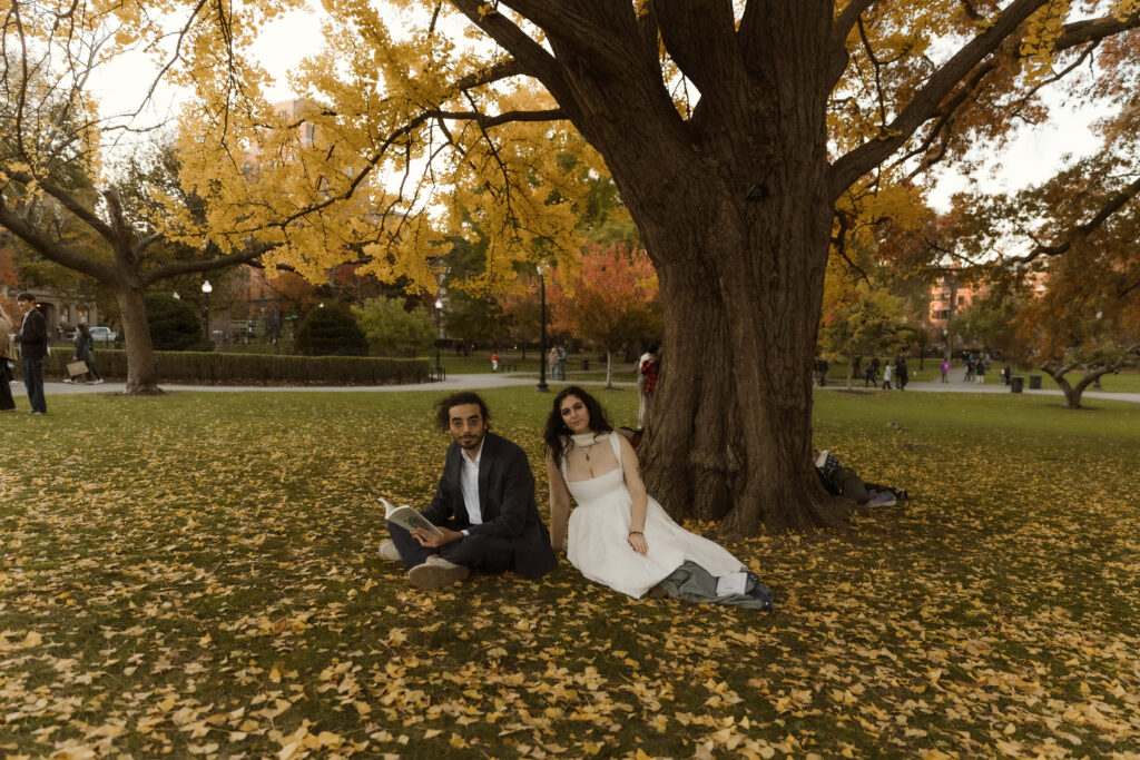 Courtney and George laughing together in Boston Common during their engagement session