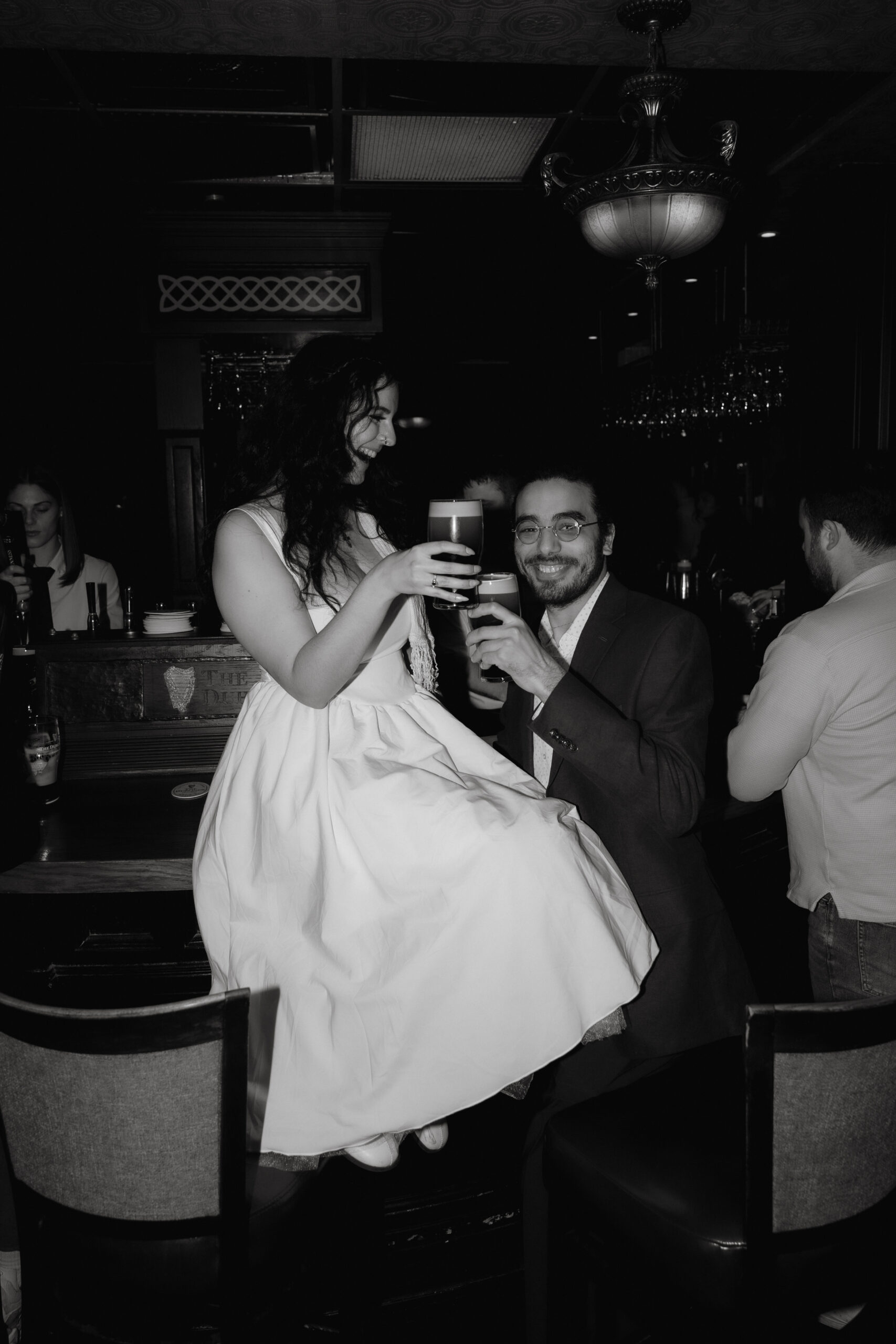 Courtney and George riding the Boston Green Line subway during their engagement session