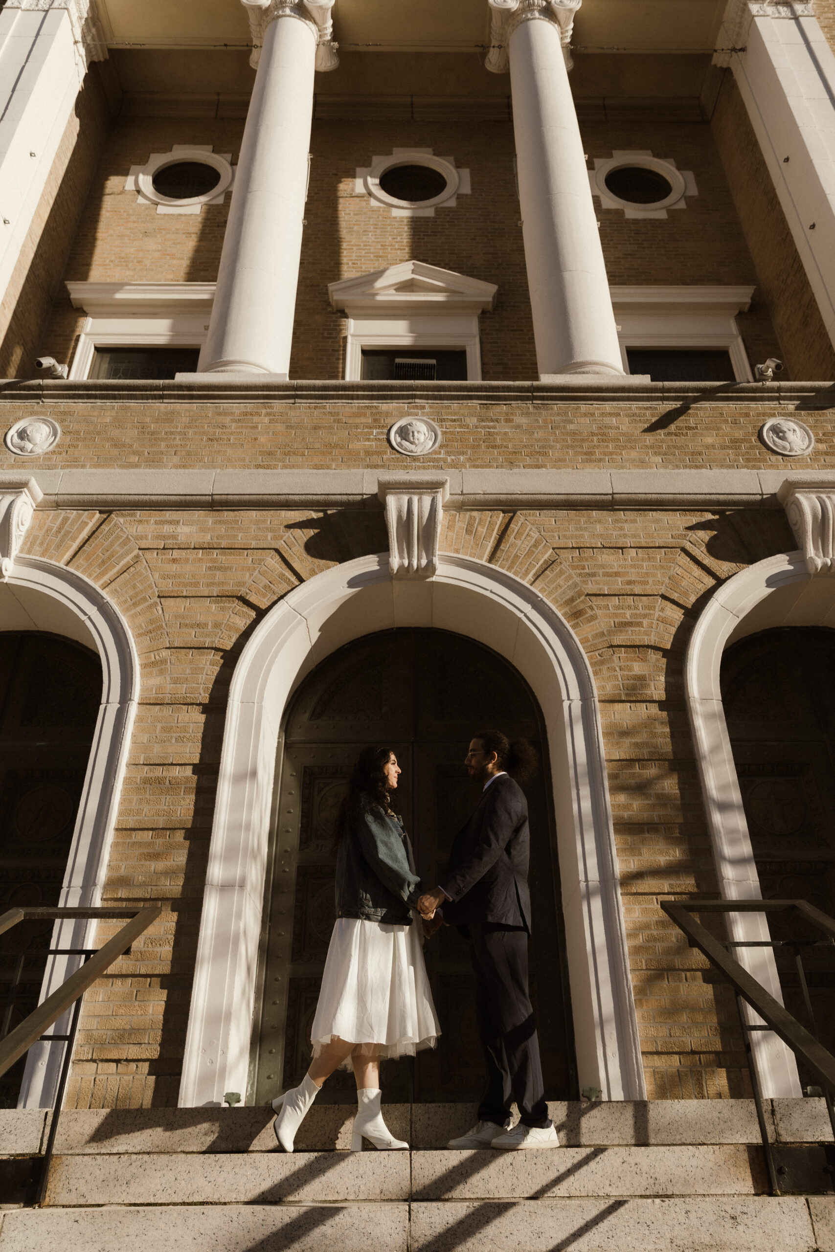 Courtney and George laughing together in Boston Common during their engagement session