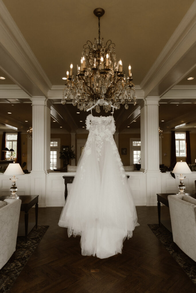 Bride getting ready in a suite at The Sagamore Resort during a fall wedding in Lake George
