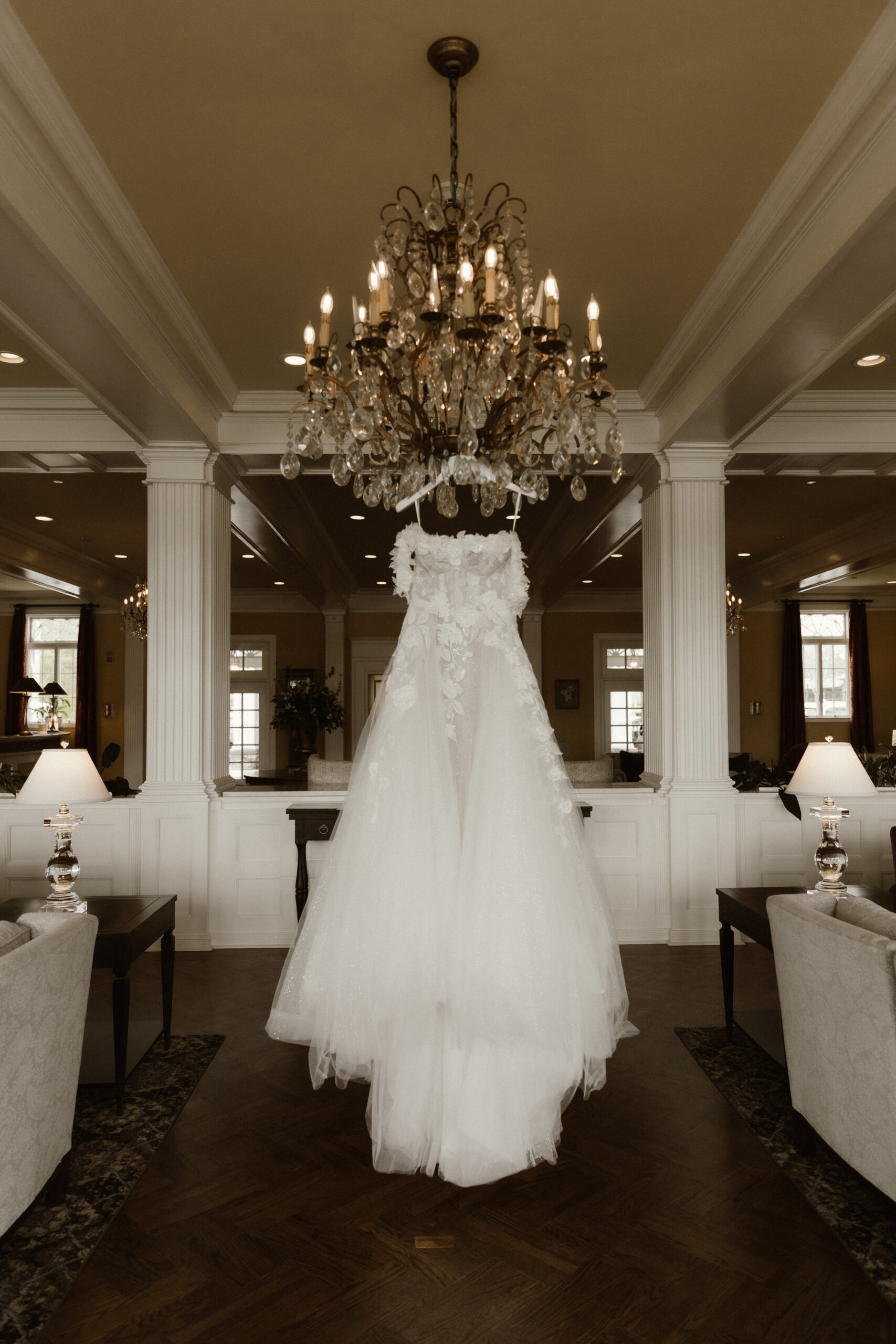 Bride getting ready in a suite at The Sagamore Resort during a fall wedding in Lake George