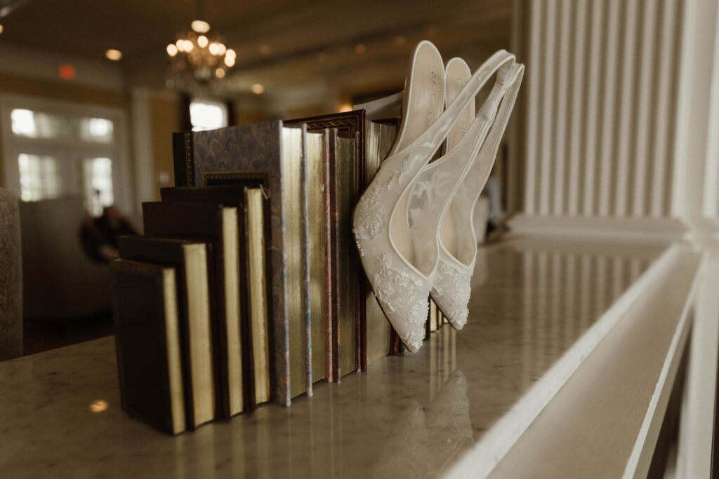 Bride getting ready in a suite at The Sagamore Resort during a fall wedding in Lake George