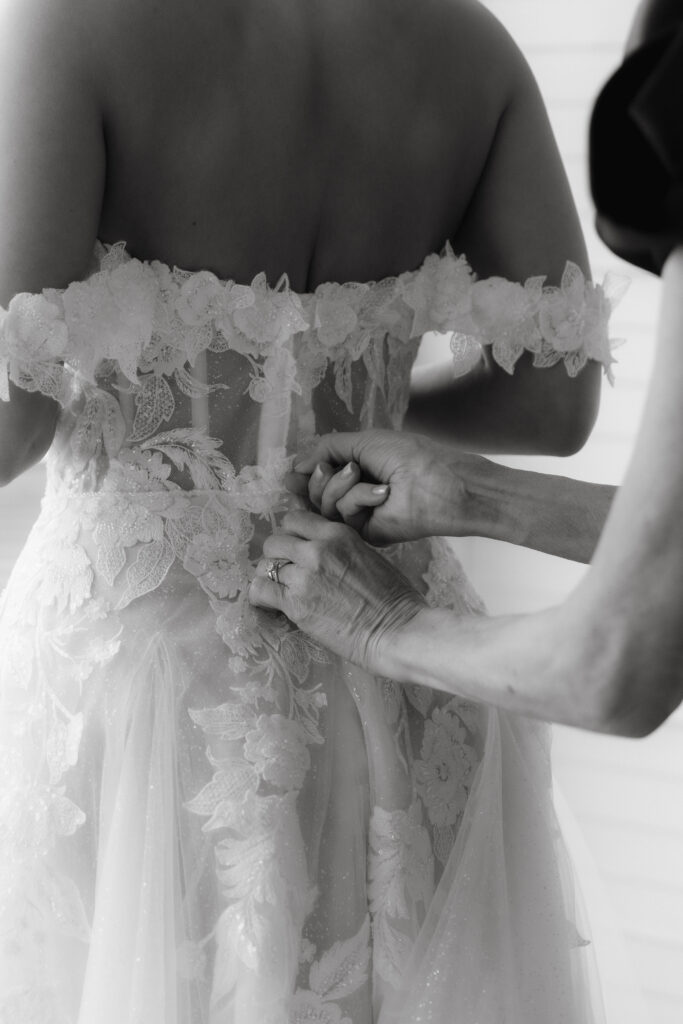 Bride getting ready in a suite at The Sagamore Resort during a fall wedding in Lake George