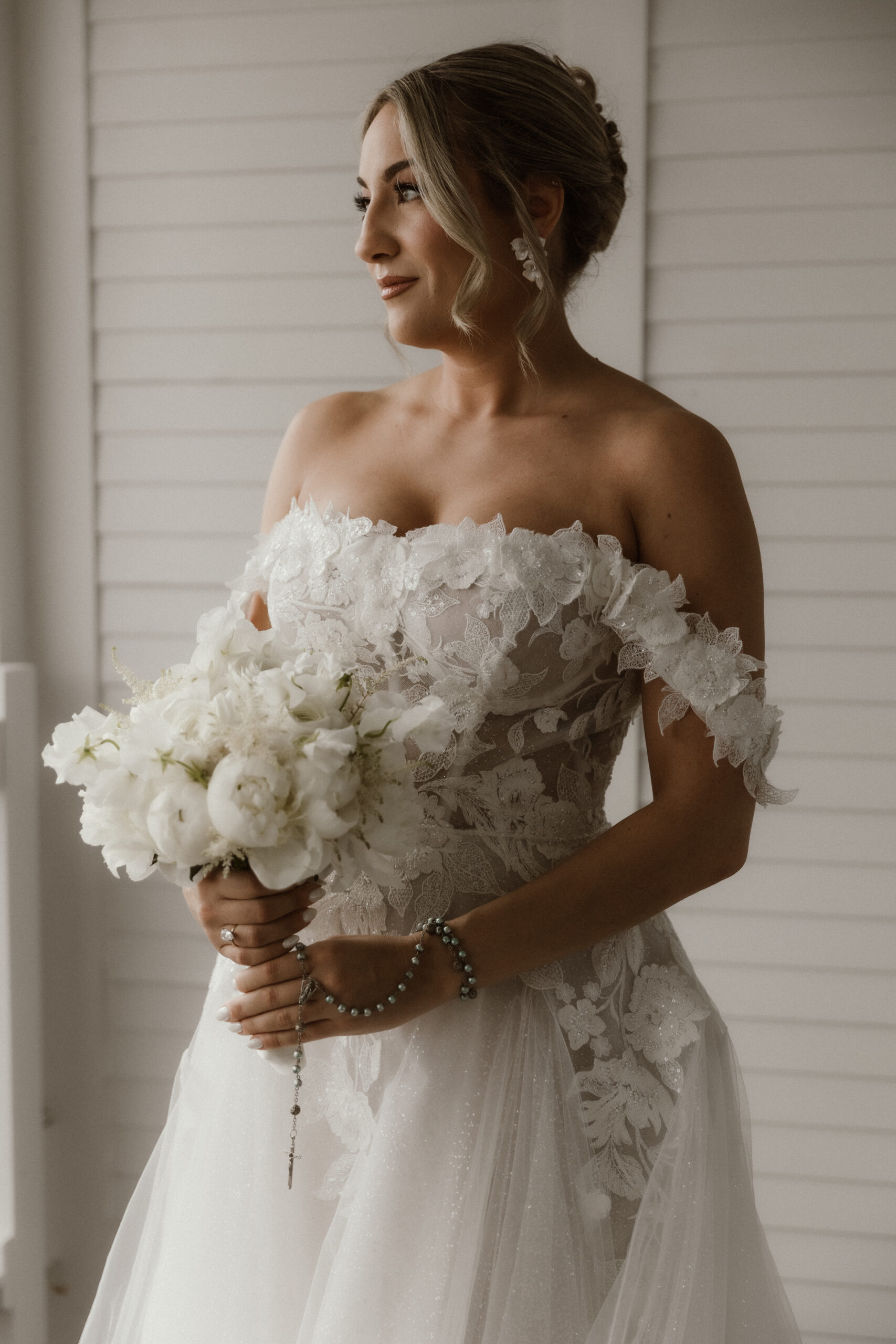 Bride getting ready in a suite at The Sagamore Resort during a fall wedding in Lake George