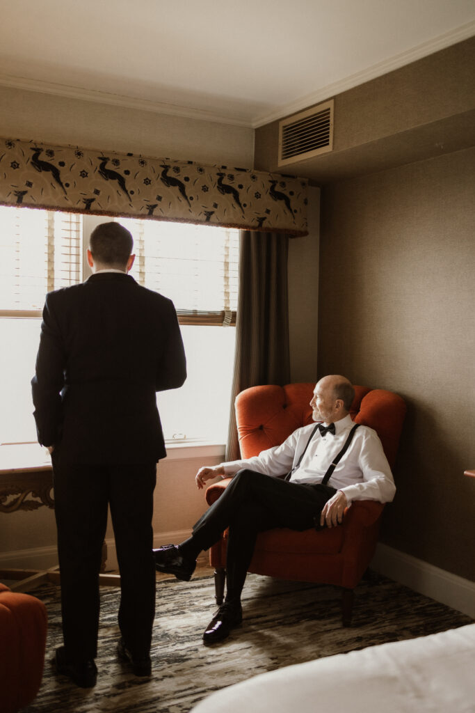 Bride getting ready in a suite at The Sagamore Resort during a fall wedding in Lake George