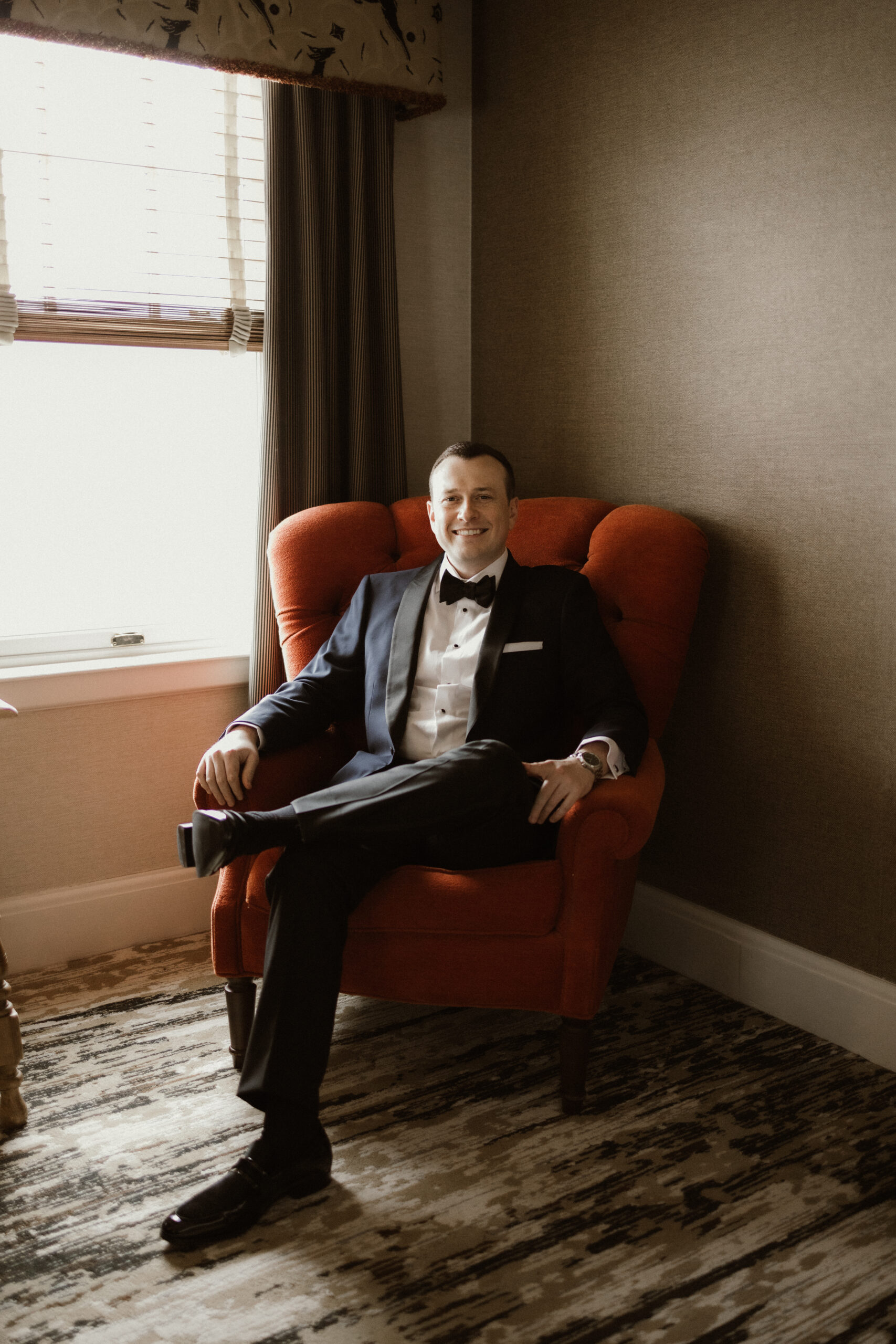 Bride getting ready in a suite at The Sagamore Resort during a fall wedding in Lake George