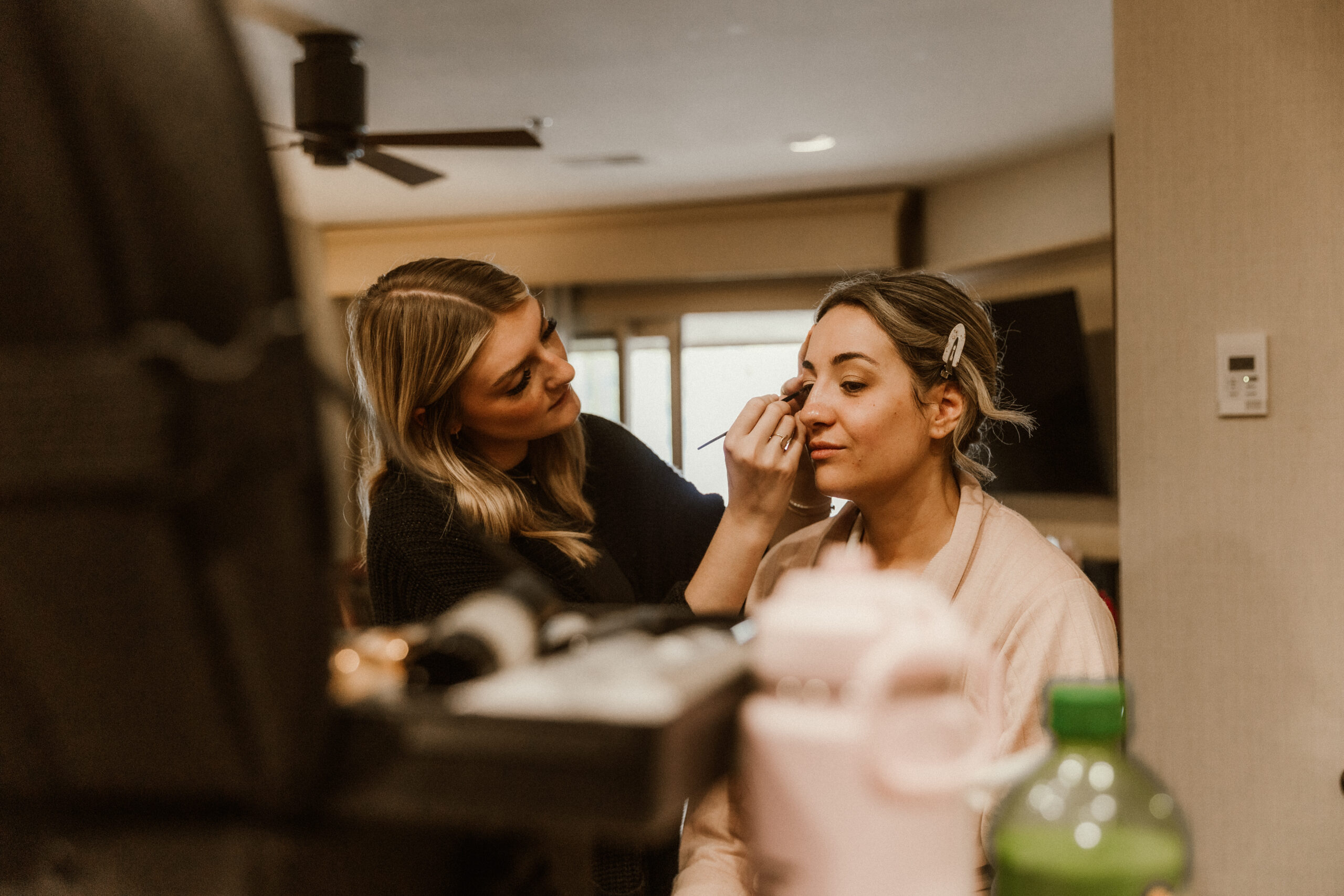 Bride getting ready in a suite at The Sagamore Resort during a fall wedding in Lake George