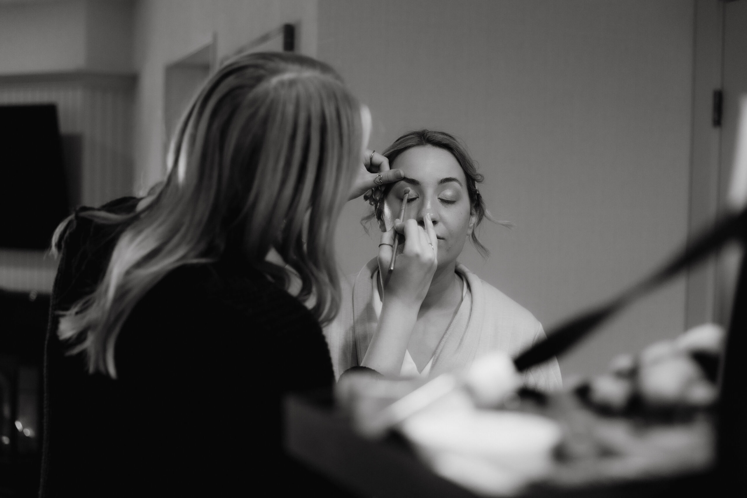 Bride getting ready in a suite at The Sagamore Resort during a fall wedding in Lake George